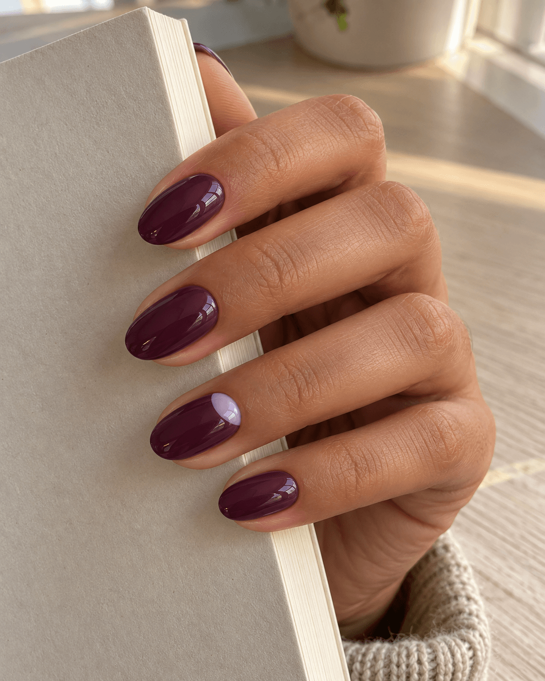 Deep plum set with a soft lilac half-moon patch on one ring nail; no metallic border.